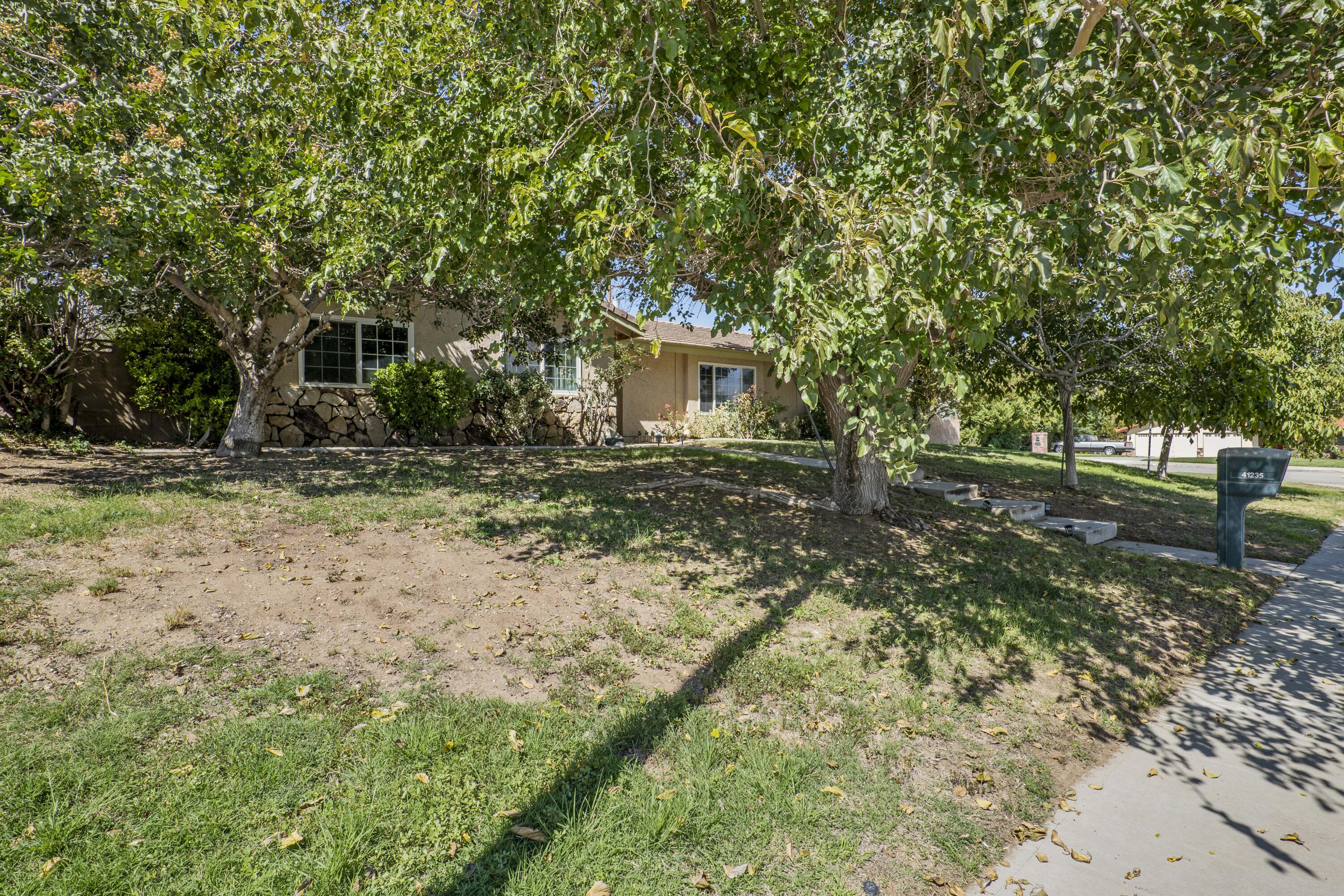 41235 47th Street West Lancaster, CA 93536 - Photo 41 of 43 a house view with a backyard space