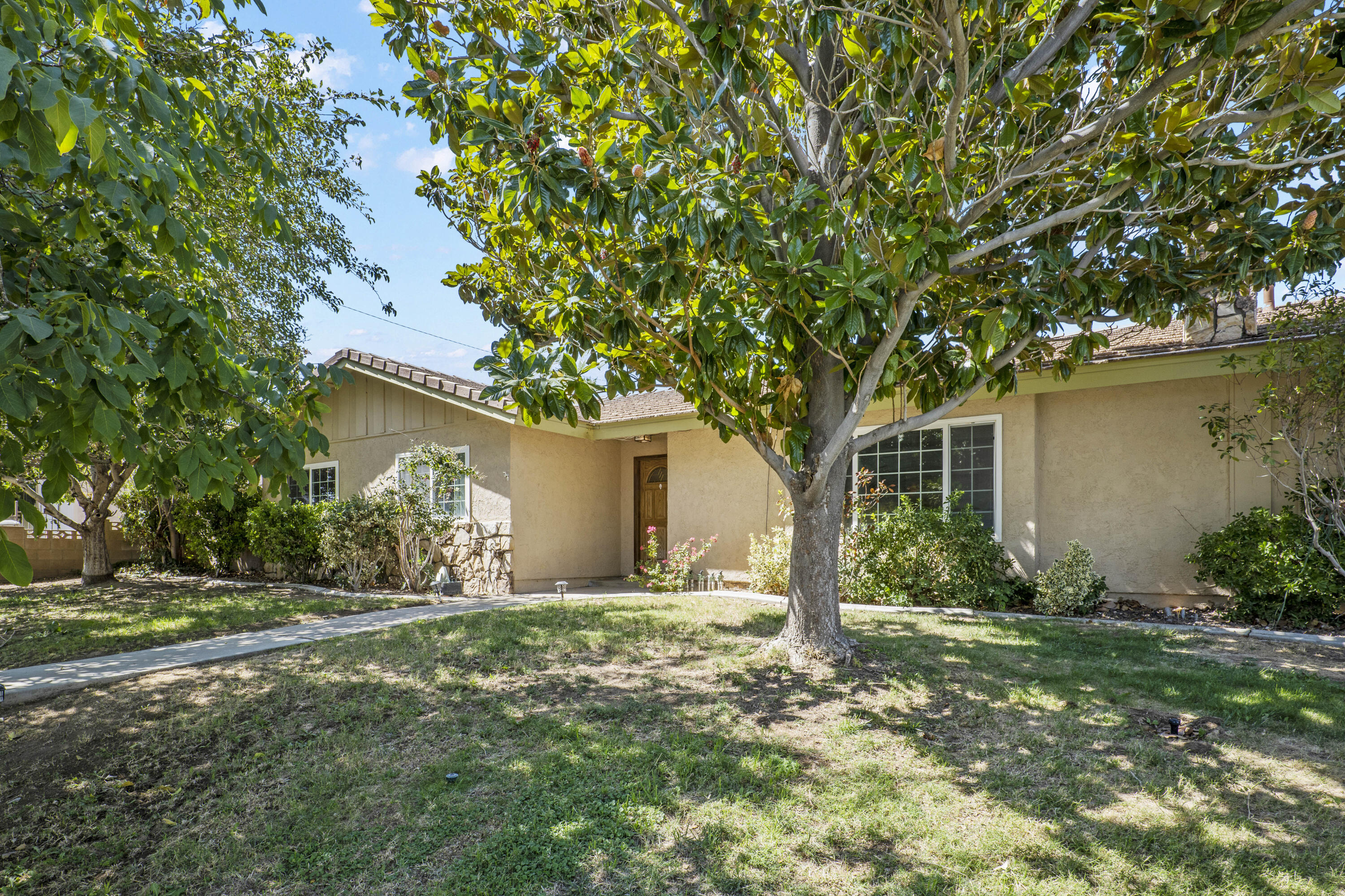 41235 47th Street West Lancaster, CA 93536 - Photo 43 of 43 a front view of house with yard and trees