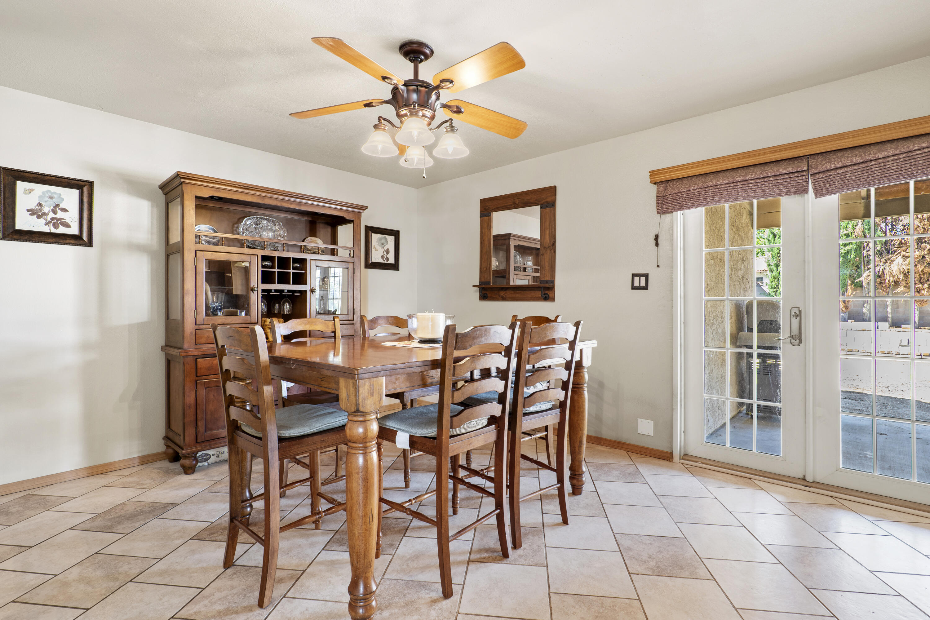 41235 47th Street West Lancaster, CA 93536 - Photo 10 of 43 a view of a dining room with furniture and chandelier