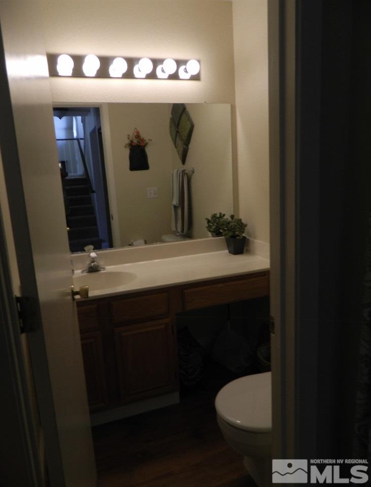 5885 Starcrest Avenue Reno, NV 89523 - Photo 18 of 18 a bathroom with a sink and a mirror
