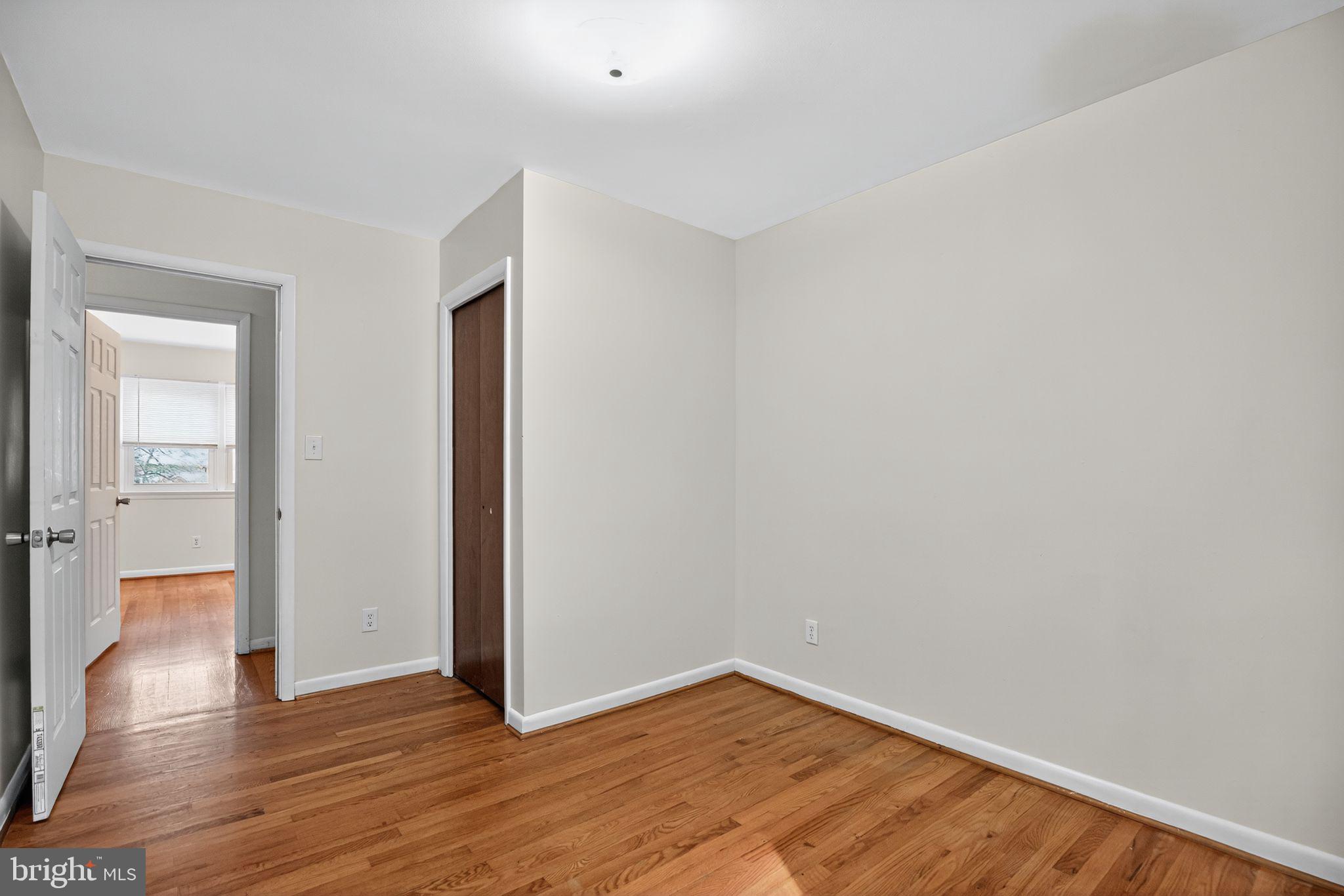 45869 Belvoir Road Great Mills, MD 20634 - Photo 14 of 30 a view of an empty room with wooden floor