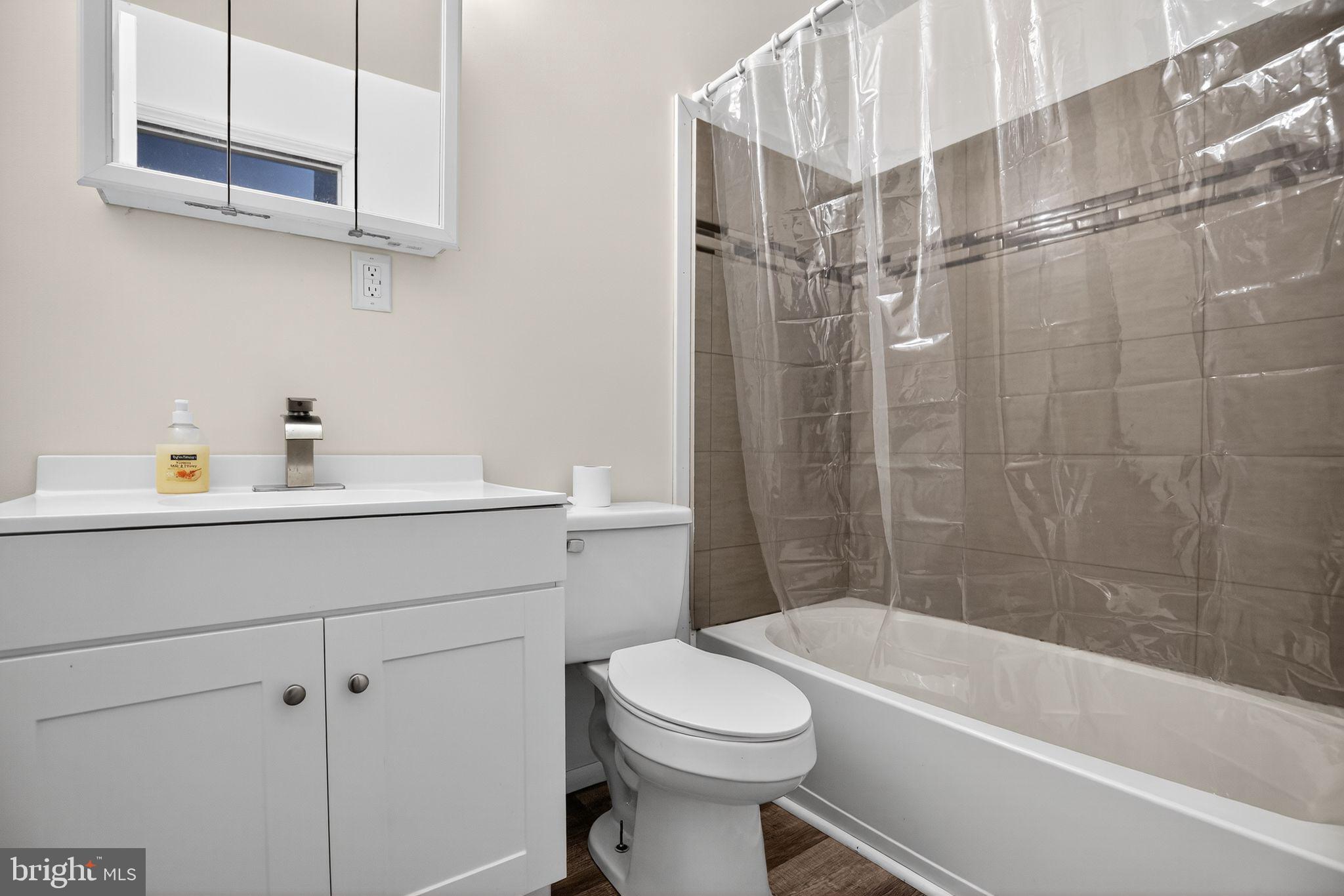 45869 Belvoir Road Great Mills, MD 20634 - Photo 18 of 30 a bathroom with a sink a toilet and shower