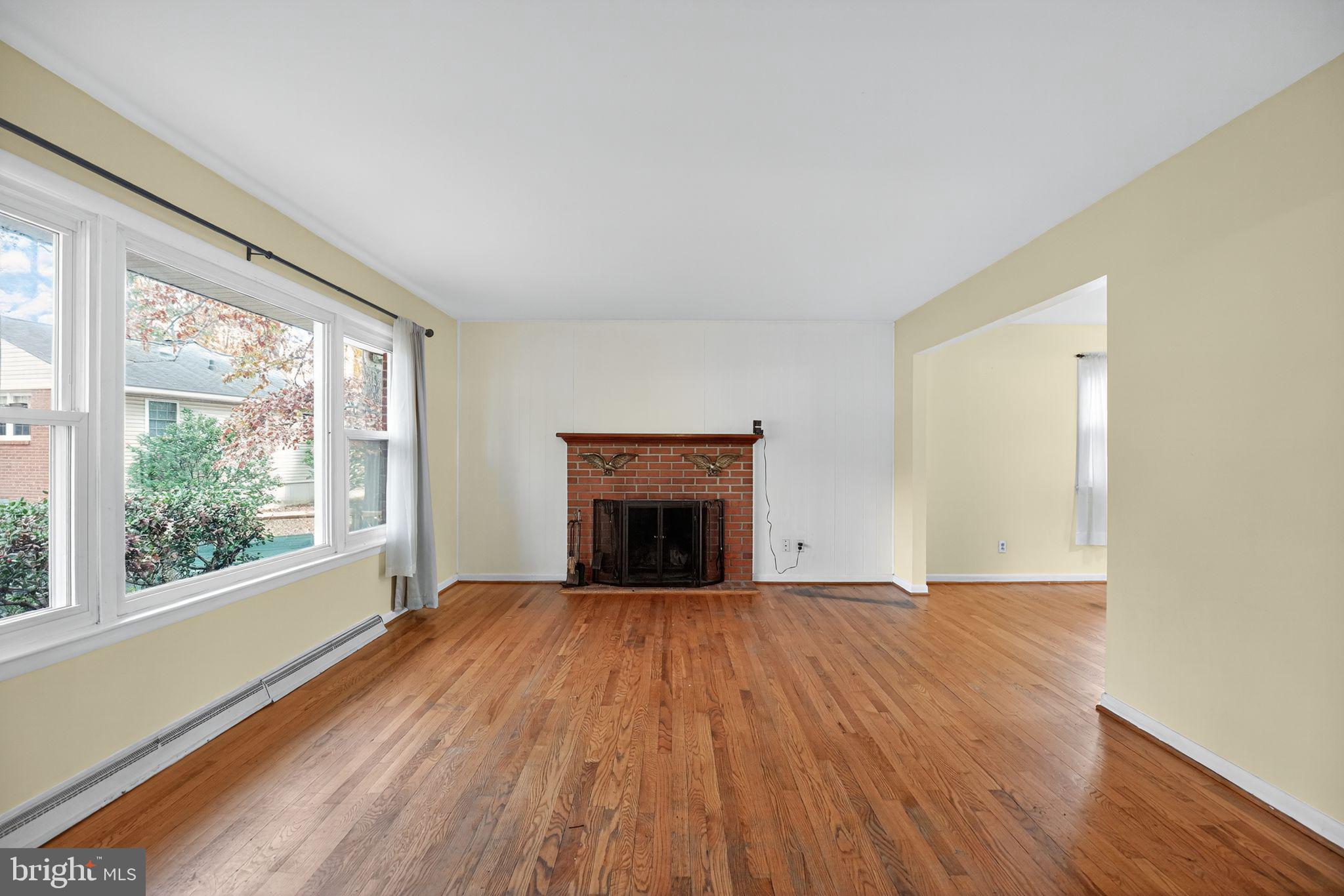 45869 Belvoir Road Great Mills, MD 20634 - Photo 5 of 30 a view of an empty room with a window and wooden floor