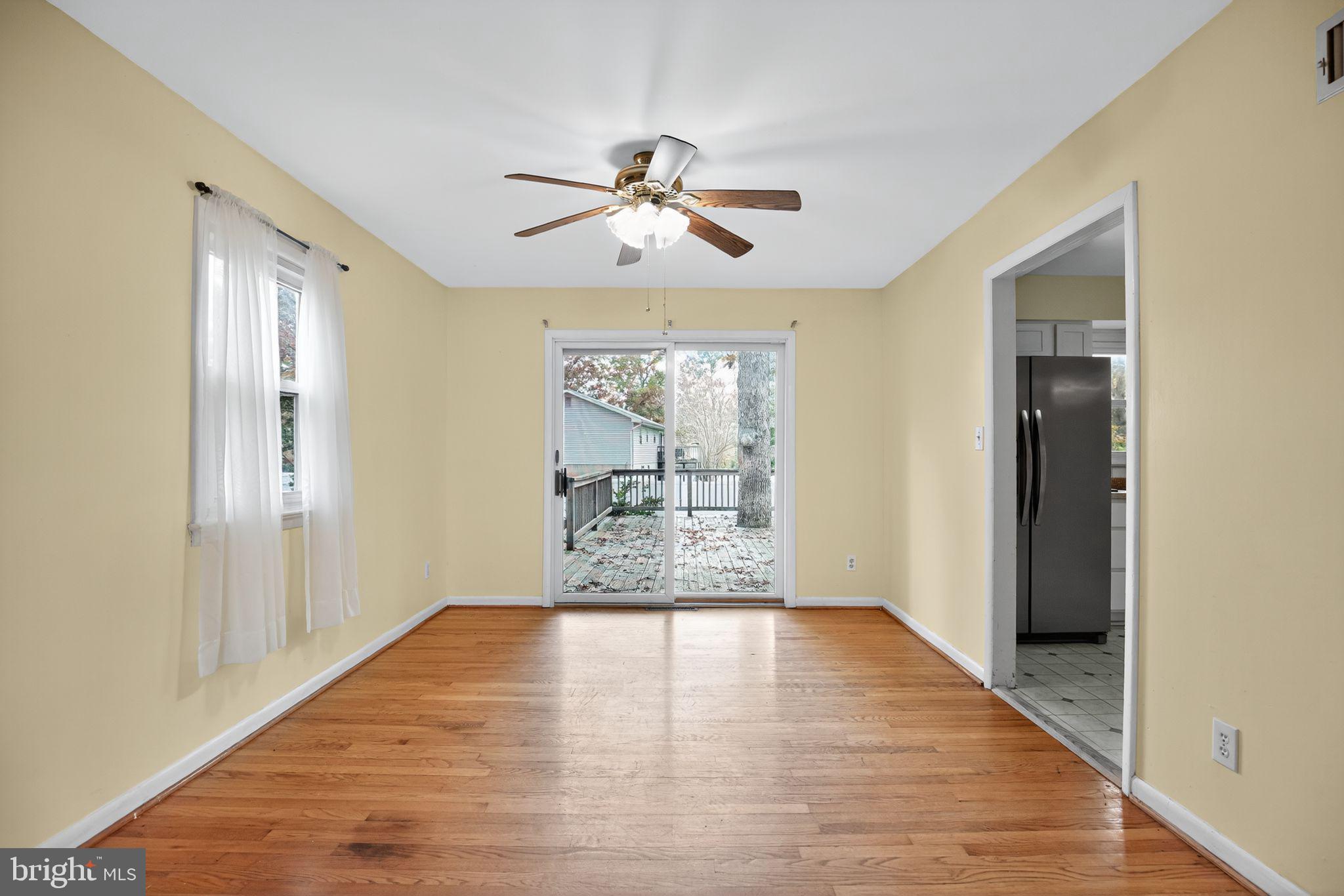 45869 Belvoir Road Great Mills, MD 20634 - Photo 8 of 30 a view of empty room with wooden floor and fan
