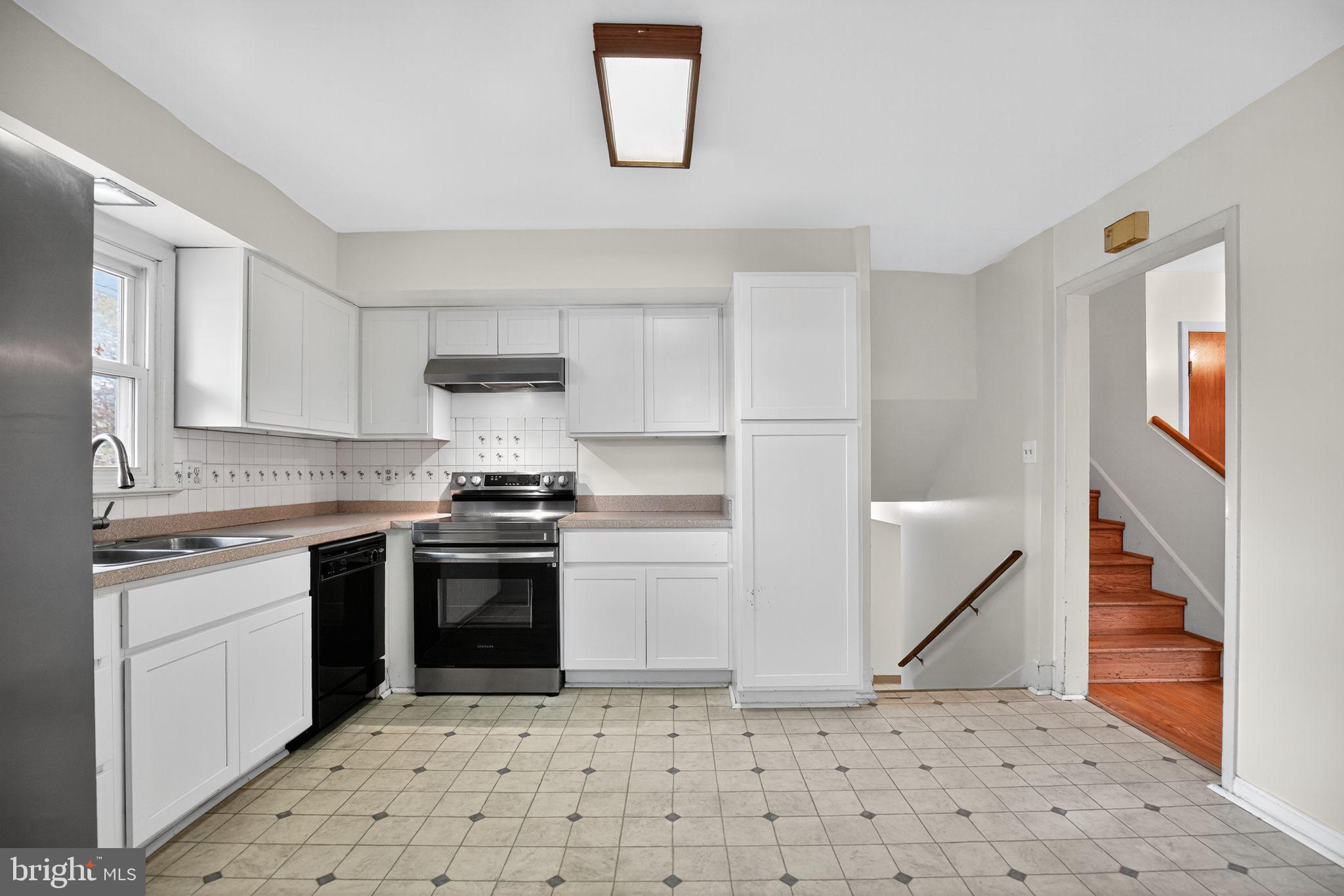 45869 Belvoir Road Great Mills, MD 20634 - Photo 10 of 30 a kitchen with a stove sink and cabinets