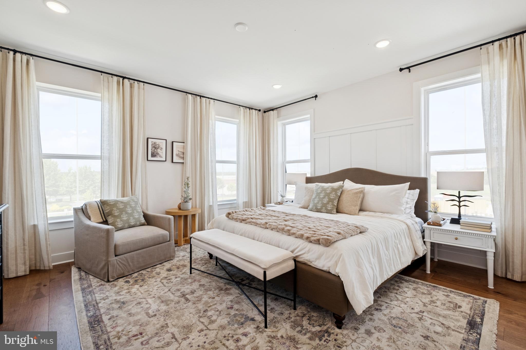 14937 Deco Circle Chantilly, VA 20151 - Photo 19 of 35 a spacious bedroom with a bed and a couch