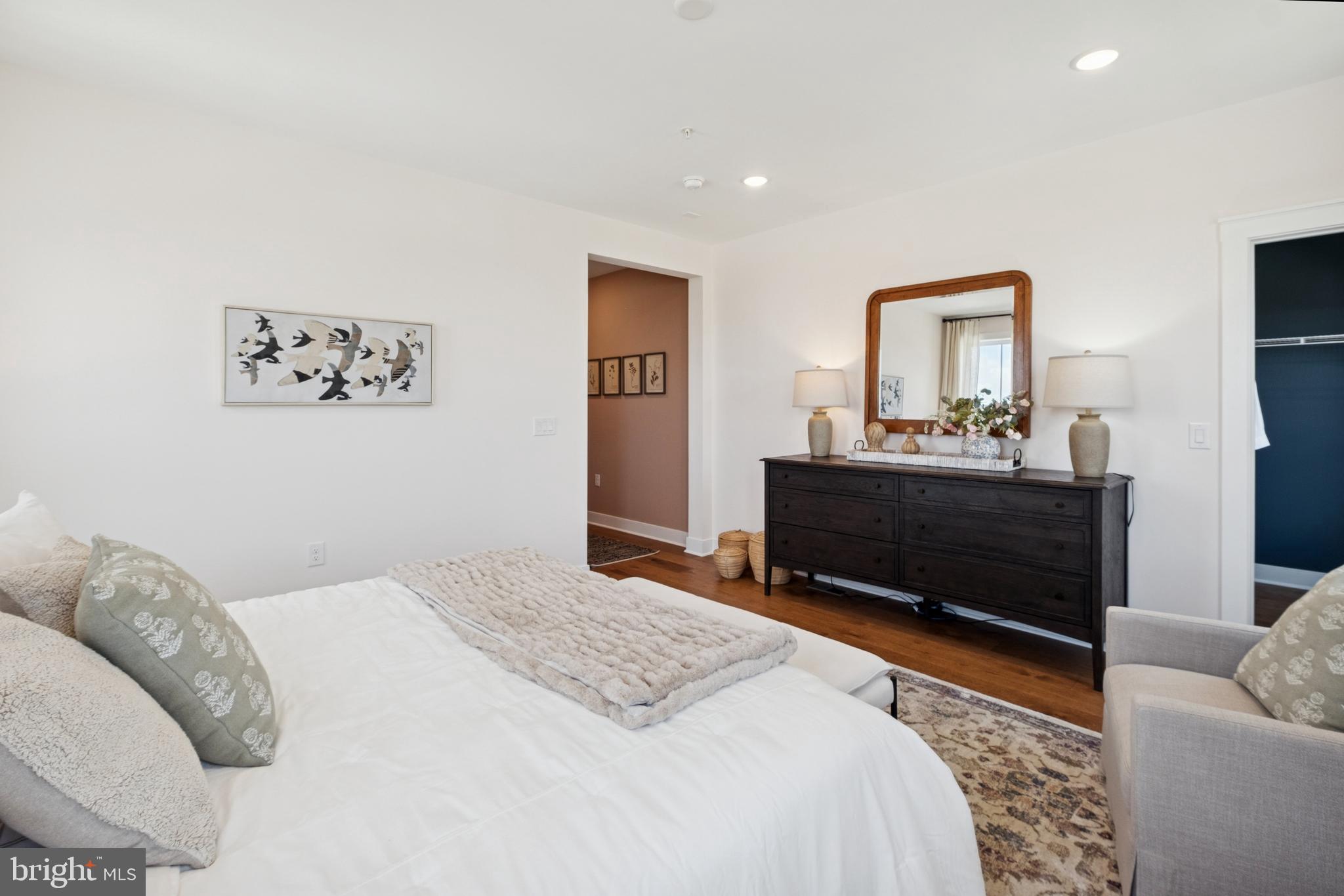 14937 Deco Circle Chantilly, VA 20151 - Photo 22 of 35 a bedroom with a bed and a couch