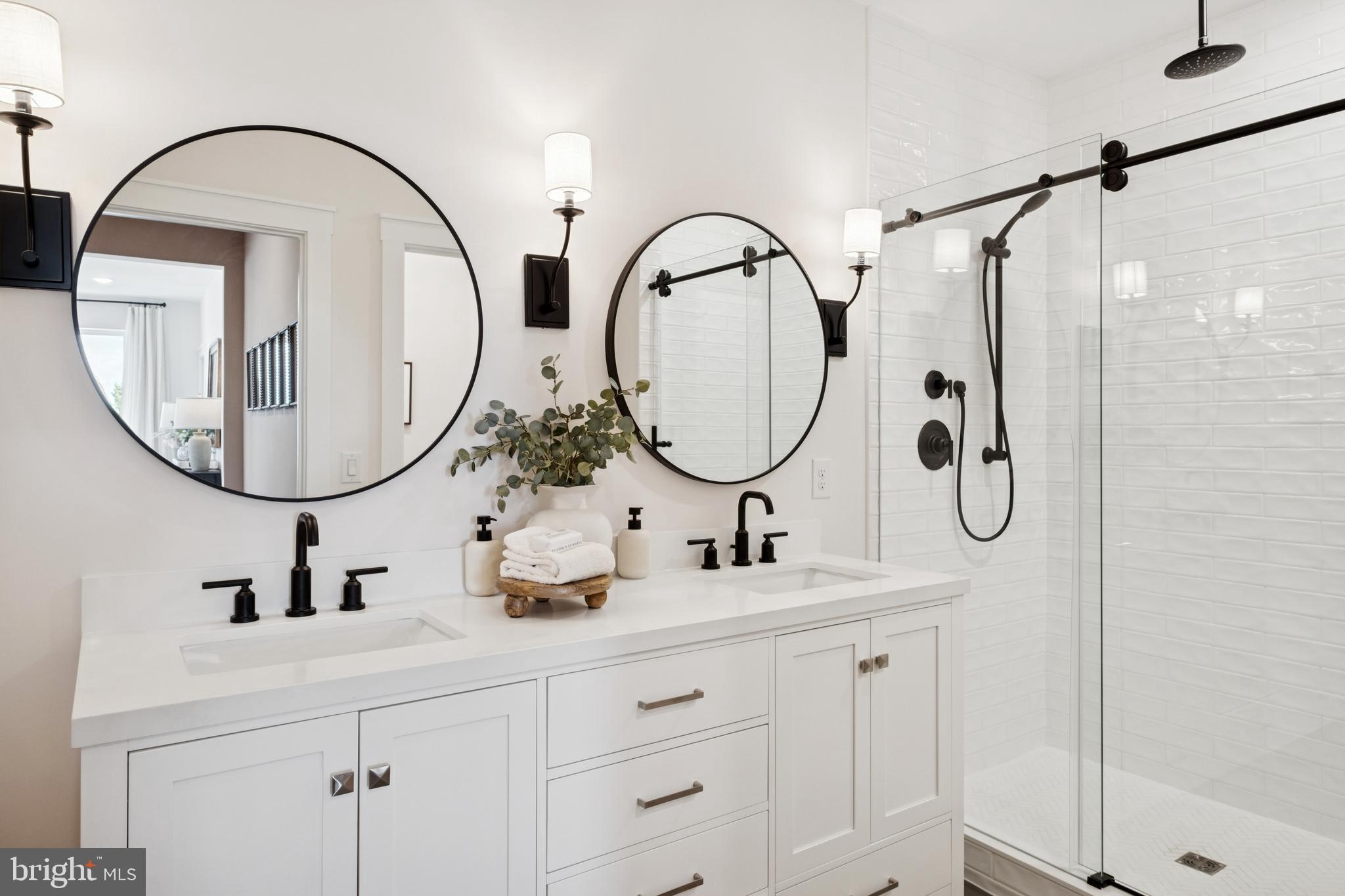 14937 Deco Circle Chantilly, VA 20151 - Photo 25 of 35 a bathroom with a double vanity sink mirror and glass door