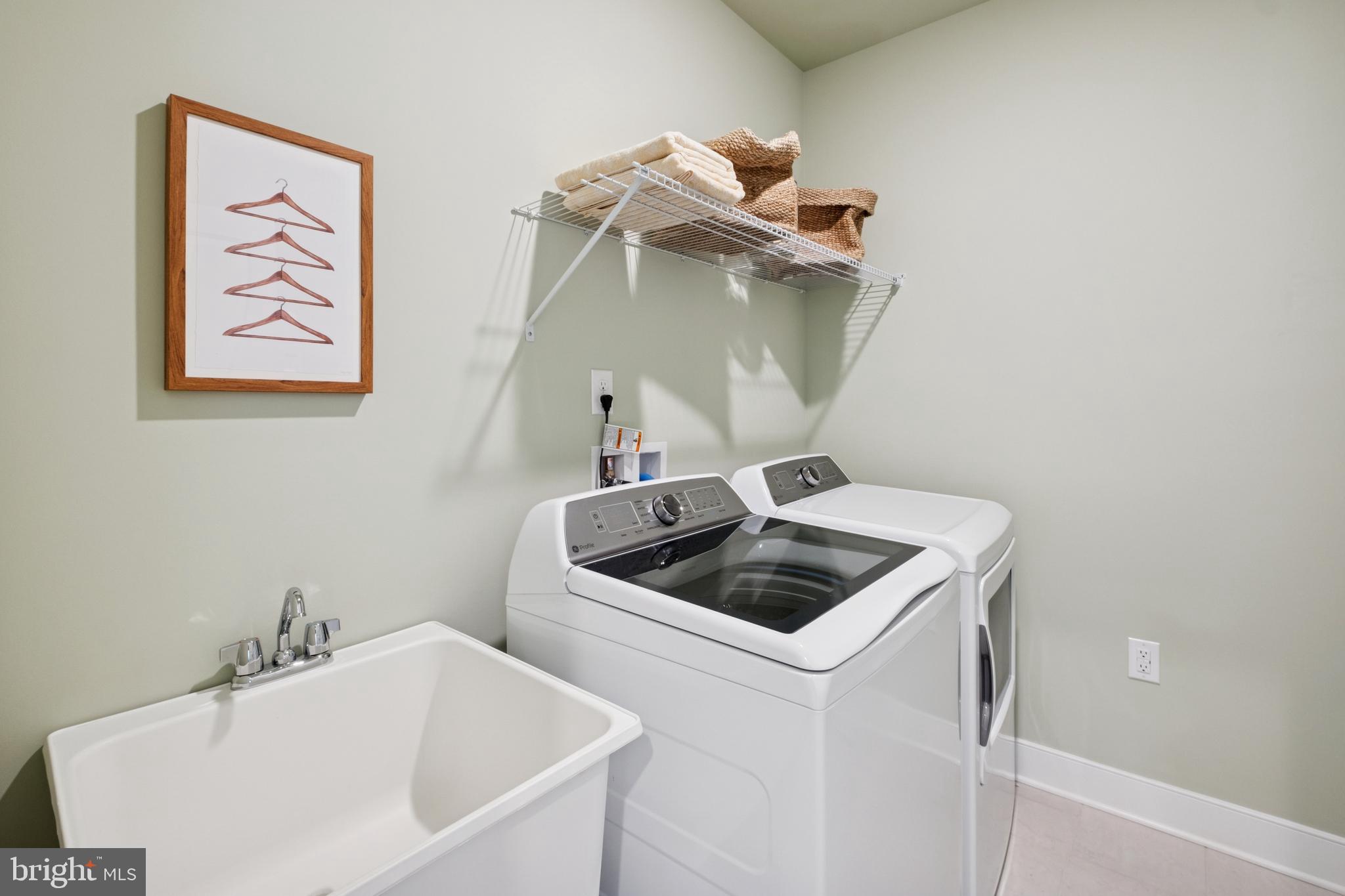14937 Deco Circle Chantilly, VA 20151 - Photo 26 of 35 a bathroom with a sink and washing machine