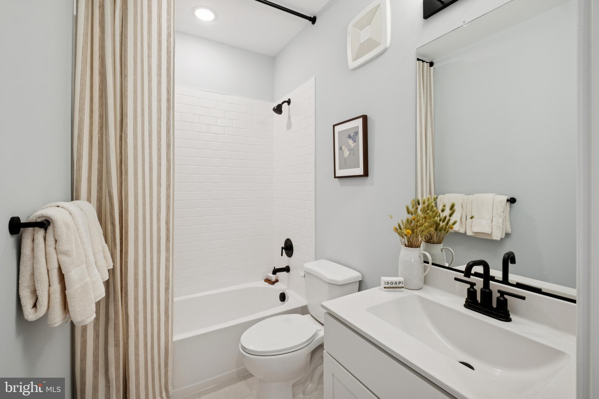 14937 Deco Circle Chantilly, VA 20151 - Photo 32 of 35 a bathroom with a sink toilet and shower