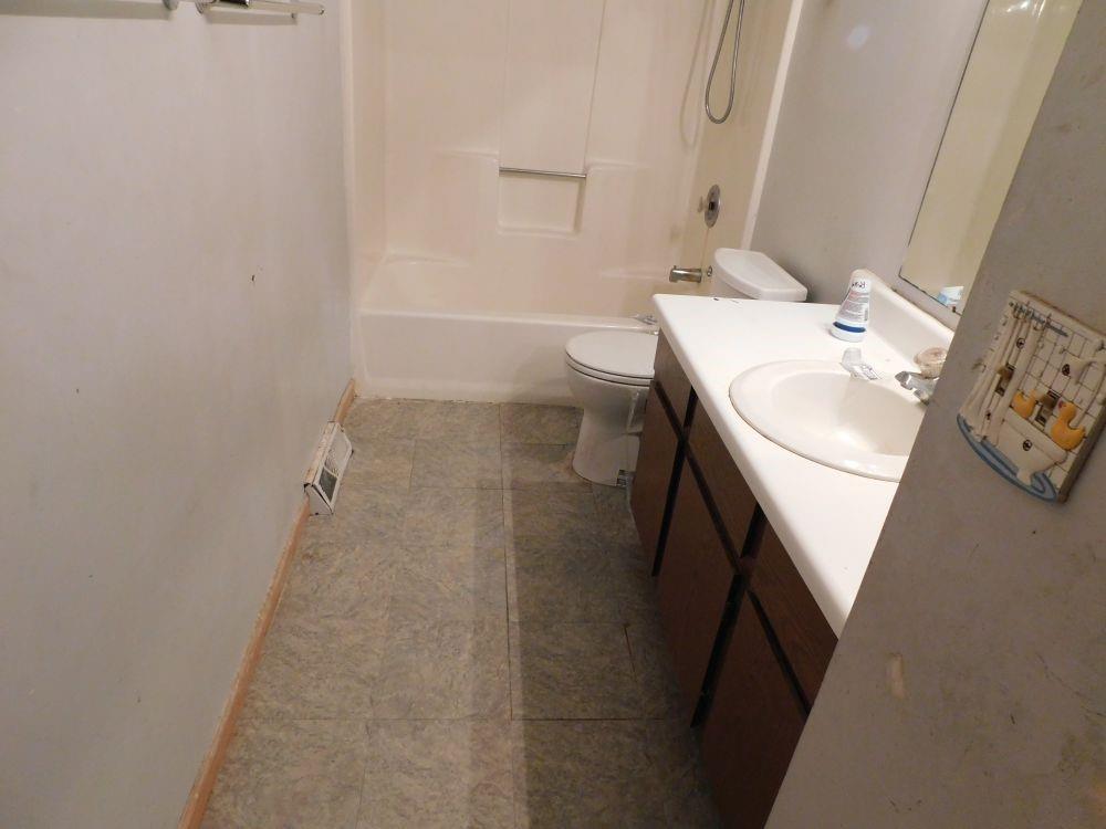 3435 East State Road Jamestown, PA 16134 - Photo 7 of 9 a bathroom with a sink toilet and tub