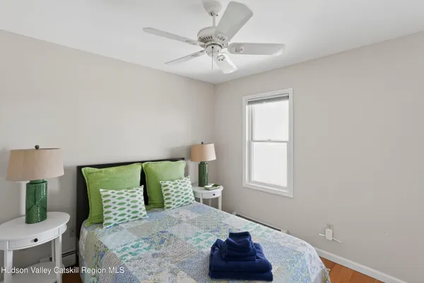 a bedroom with a bed and window