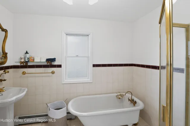 a bathroom with a bathtub and sink