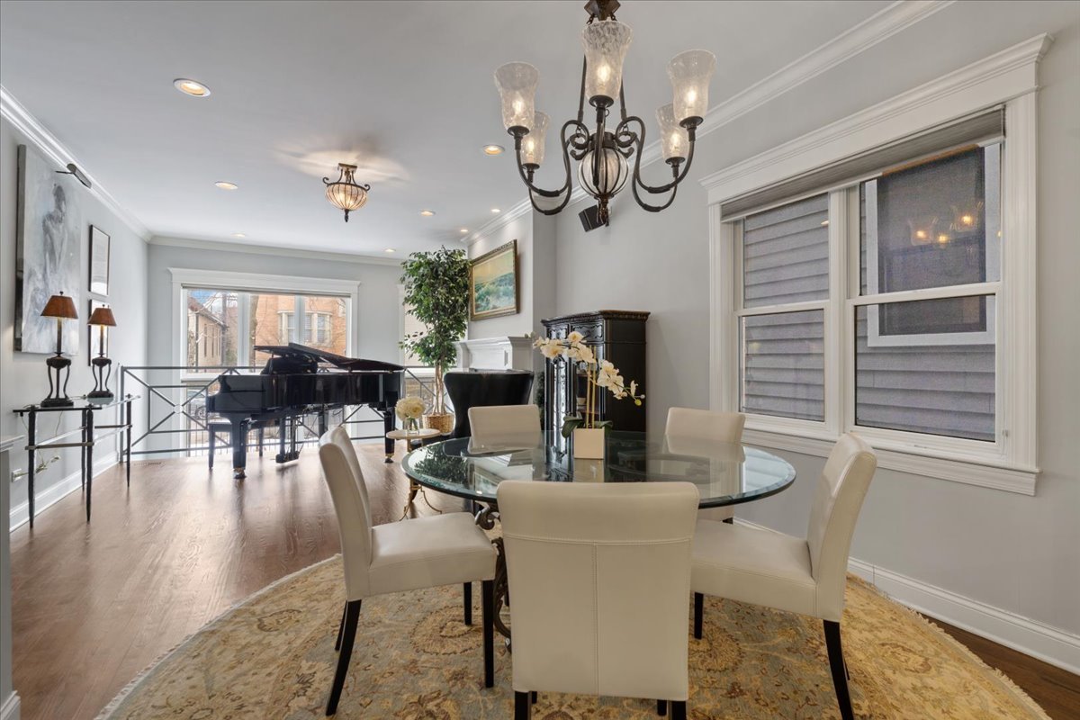 2619 North Seminary Avenue, Unit 1 Chicago, IL 60614 - Photo 6 of 34 a view of a dining room with furniture a chandelier and wooden floor