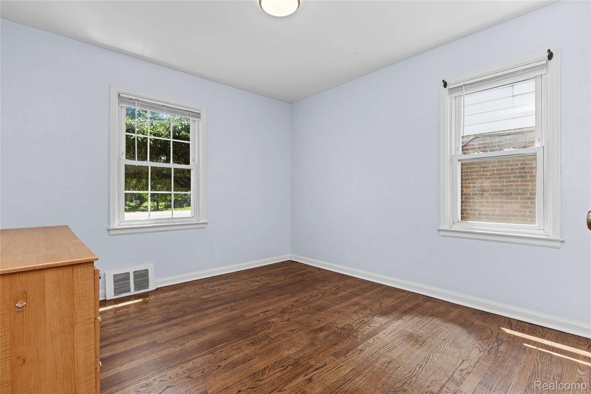 26508 Five Mile Road Redford, MI 48239 - Photo 21 of 41 Room featuring light blue walls and wood-finish flooring