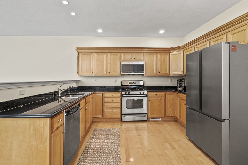 508 Linwood Court, Unit 508 Clinton, MA 01510 - Photo 12 of 32 a kitchen with a refrigerator sink and stove