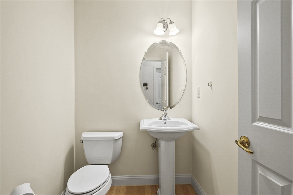 508 Linwood Court, Unit 508 Clinton, MA 01510 - Photo 18 of 32 a bathroom with a toilet sink and mirror
