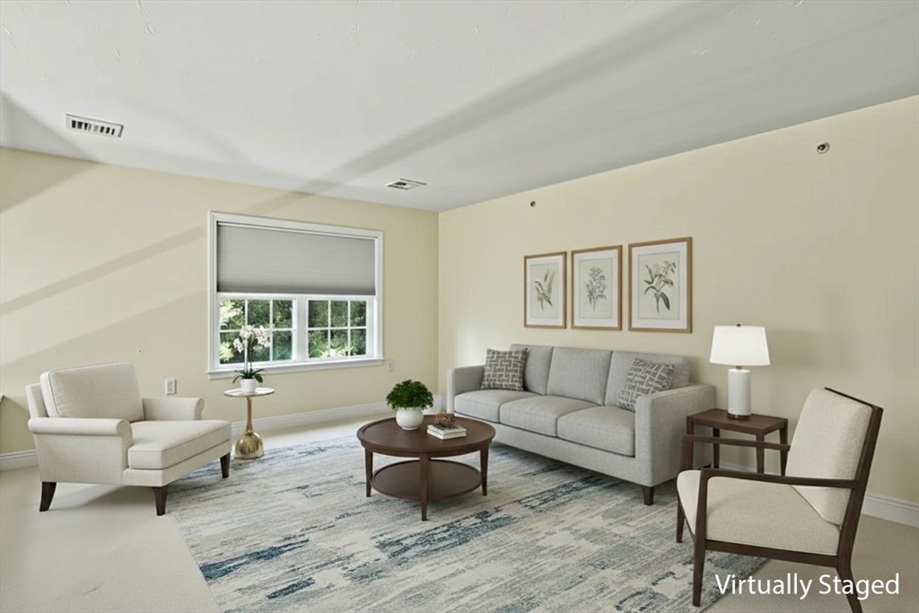 508 Linwood Court, Unit 508 Clinton, MA 01510 - Photo 19 of 32 a living room with furniture and a couch