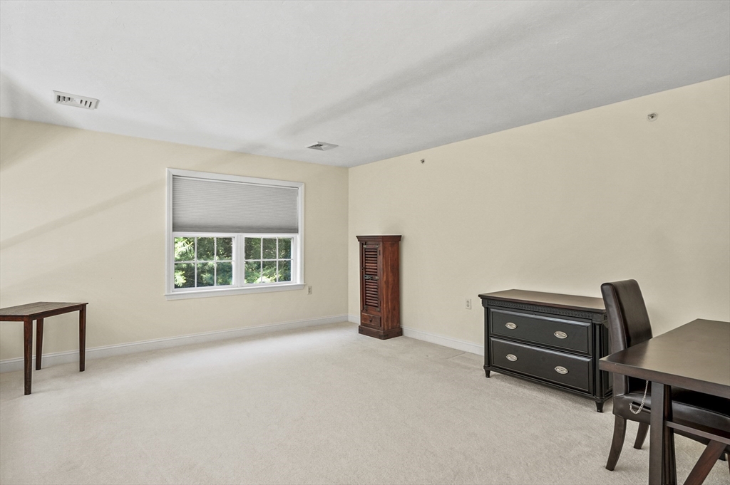 508 Linwood Court, Unit 508 Clinton, MA 01510 - Photo 20 of 32 a living room with furniture and a window
