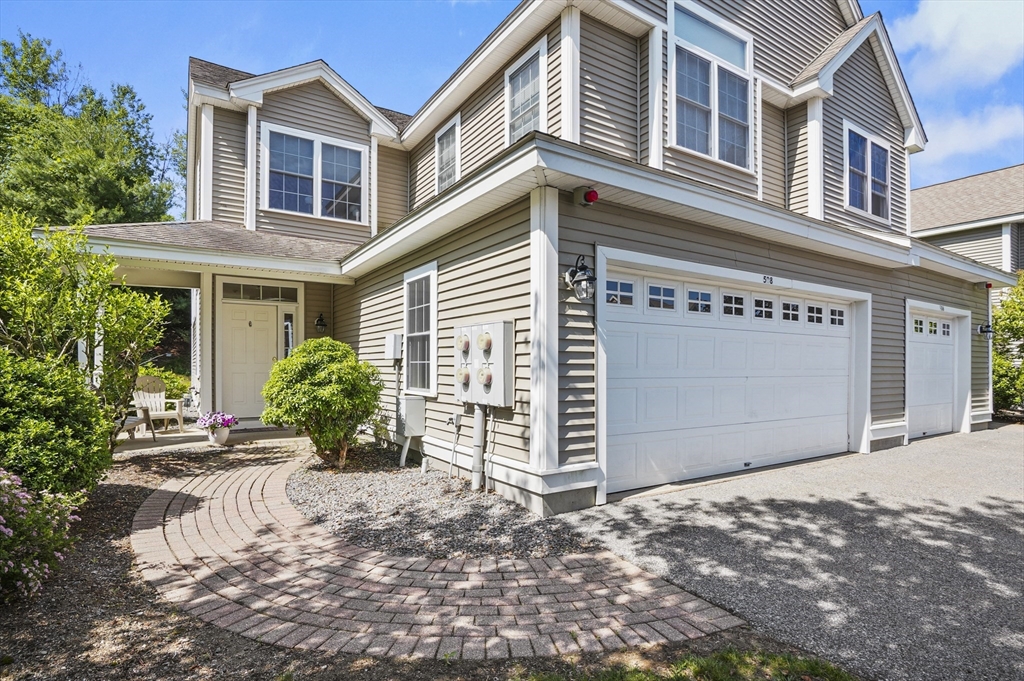508 Linwood Court, Unit 508 Clinton, MA 01510 - Photo 2 of 32 a front view of a house with a yard