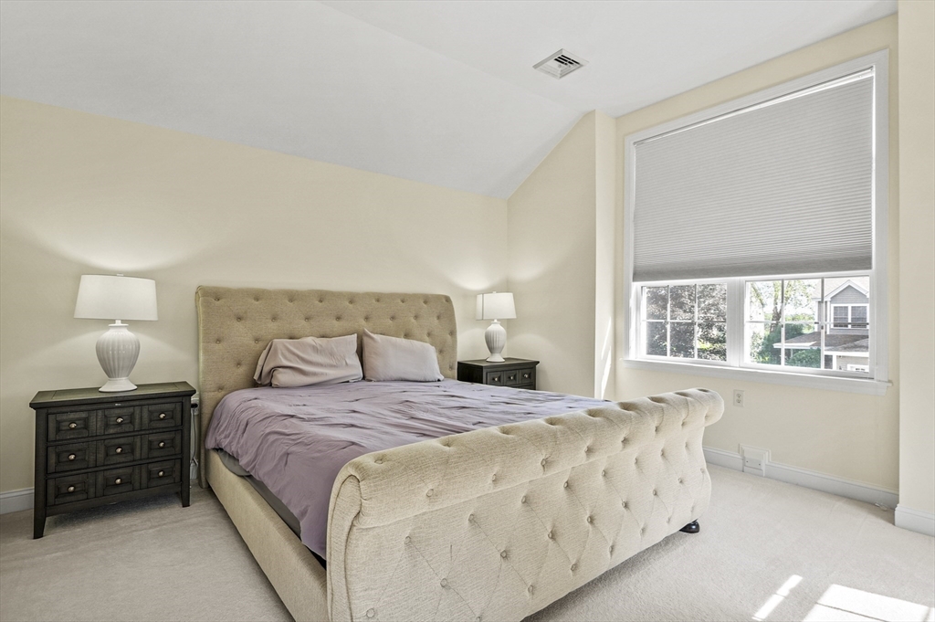 508 Linwood Court, Unit 508 Clinton, MA 01510 - Photo 23 of 32 a bedroom with a bed and a window