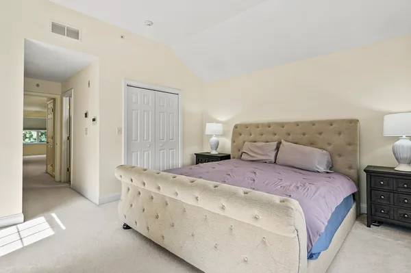 a bedroom with a bed and a cabinets