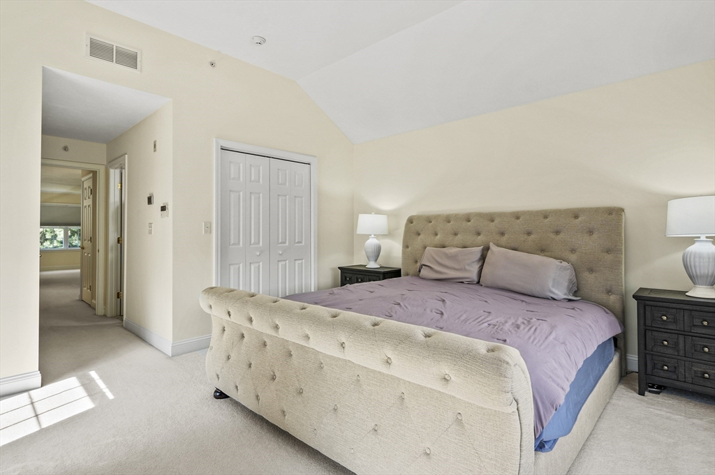 508 Linwood Court, Unit 508 Clinton, MA 01510 - Photo 24 of 32 a bedroom with a bed and a cabinets