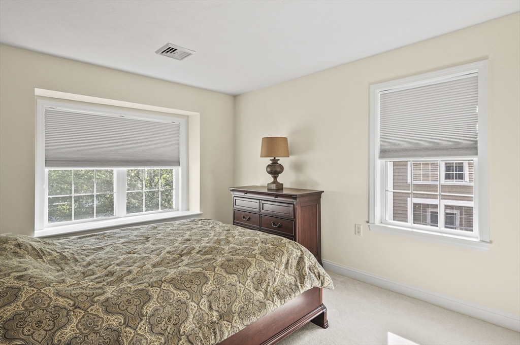 508 Linwood Court, Unit 508 Clinton, MA 01510 - Photo 26 of 32 a bedroom with a bed and a window