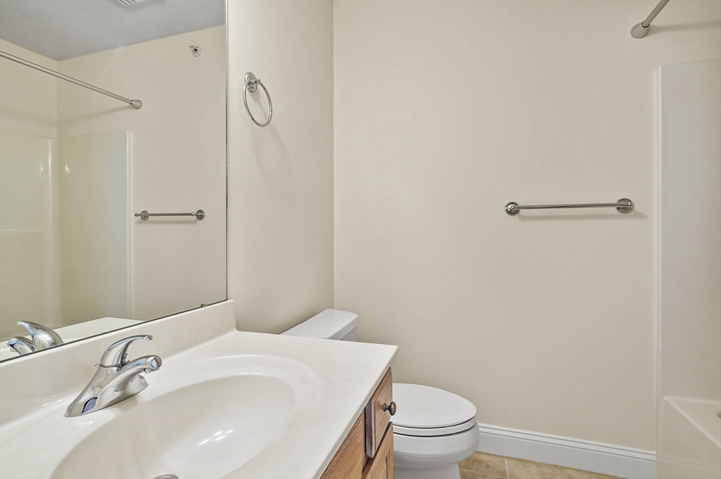 508 Linwood Court, Unit 508 Clinton, MA 01510 - Photo 28 of 32 a bathroom with a sink toilet and vanity