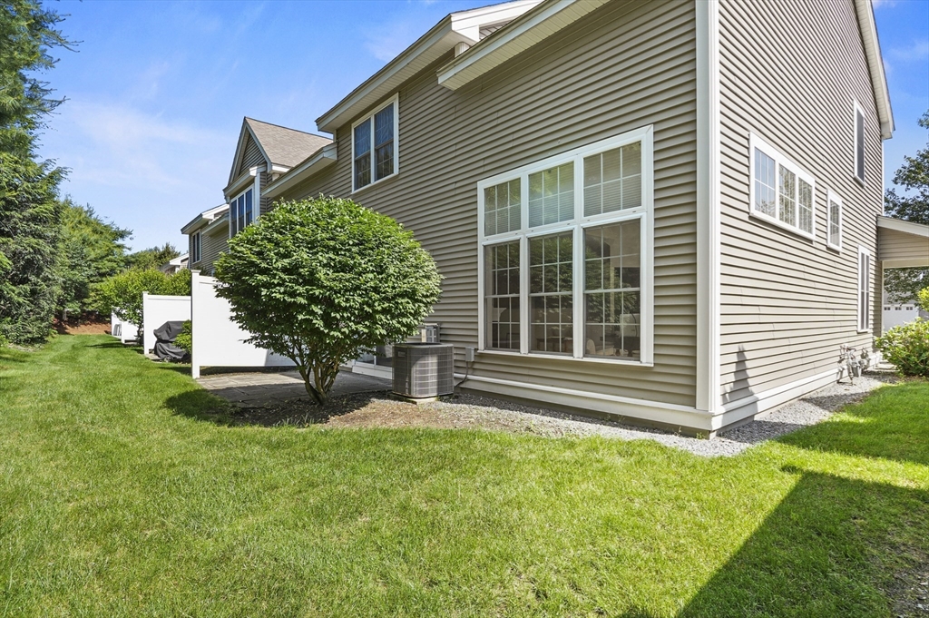 508 Linwood Court, Unit 508 Clinton, MA 01510 - Photo 30 of 32 a house with a tree front of it