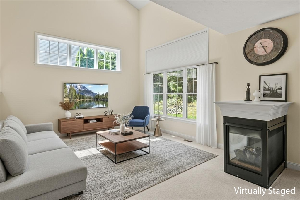 508 Linwood Court, Unit 508 Clinton, MA 01510 - Photo 4 of 32 a living room with furniture a window and a fireplace
