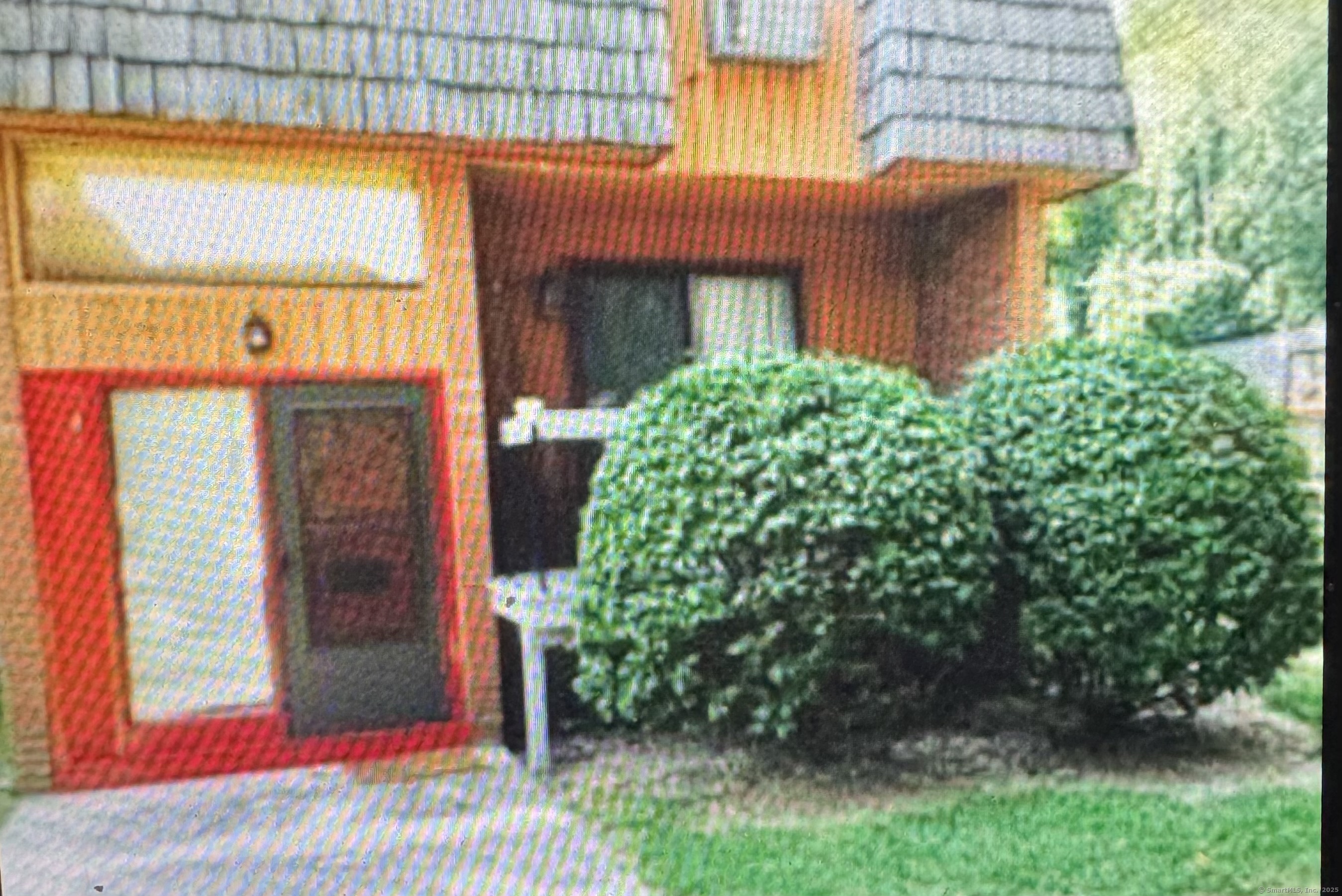 a view of a house with a garage and balcony