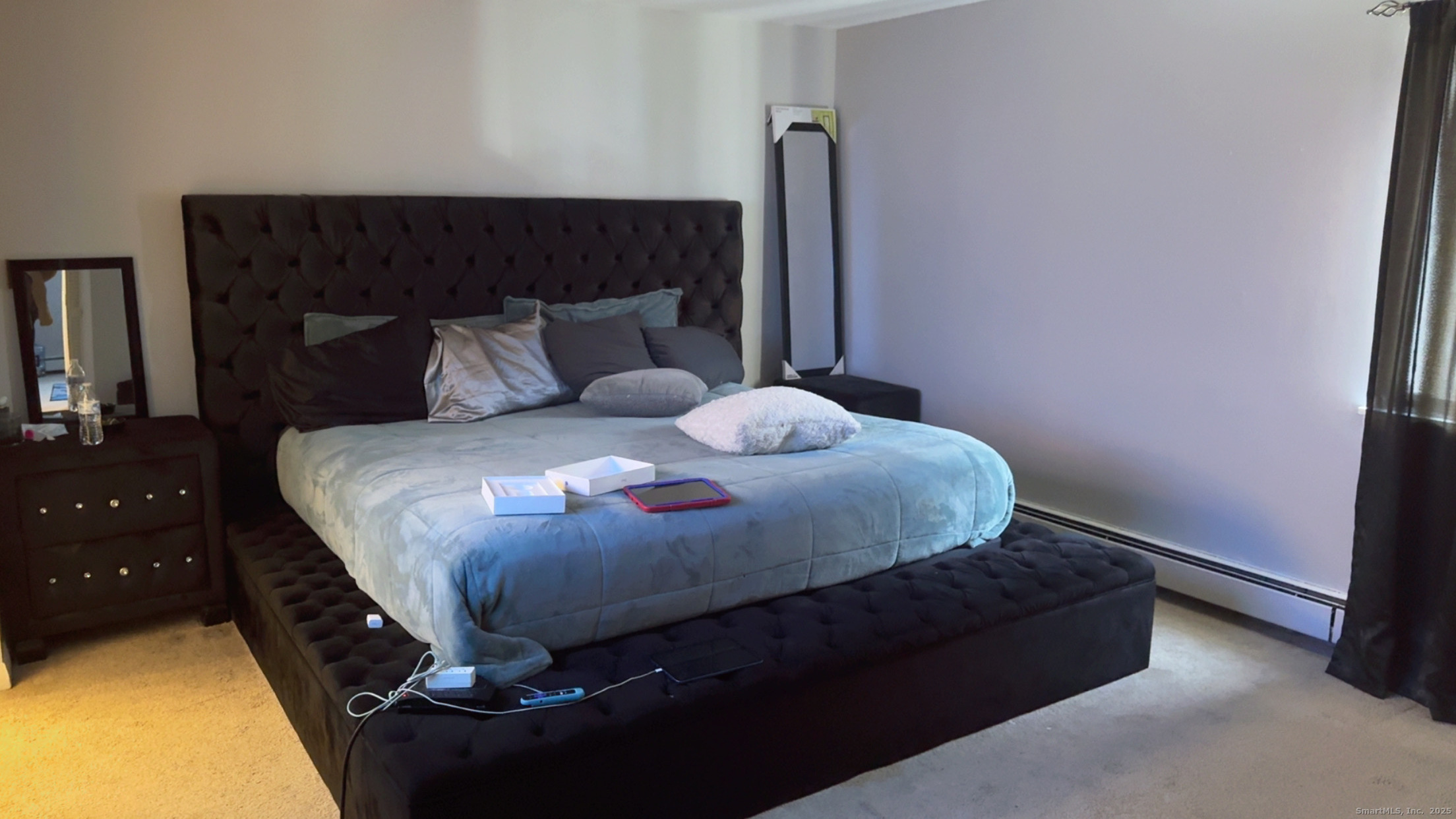 268 High Path Road, Unit 268 Windsor, CT 06095 - Photo 12 of 16 a bedroom with a bed and a potted plant