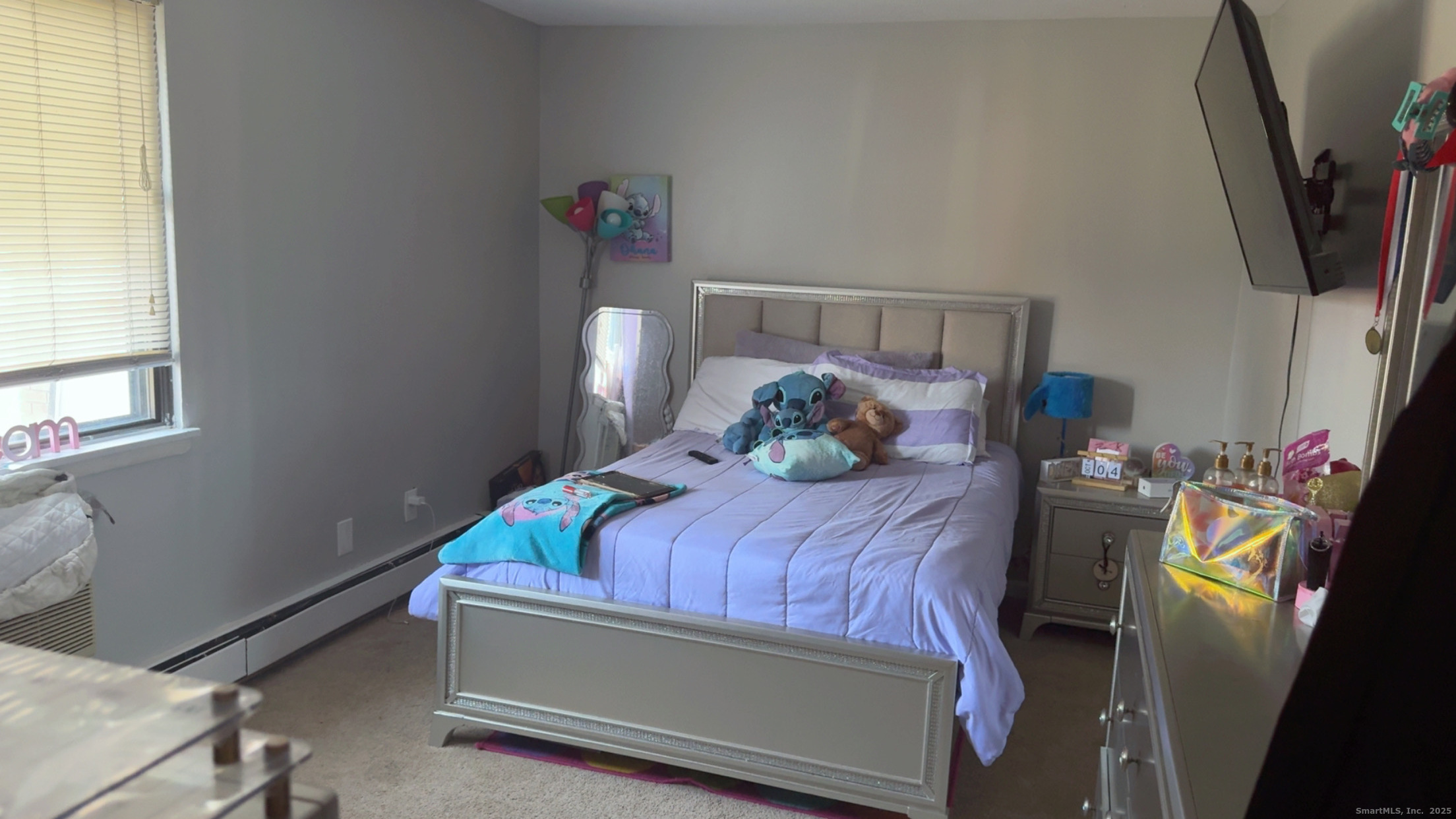 268 High Path Road, Unit 268 Windsor, CT 06095 - Photo 9 of 16 a bed sitting in a bedroom next to a window