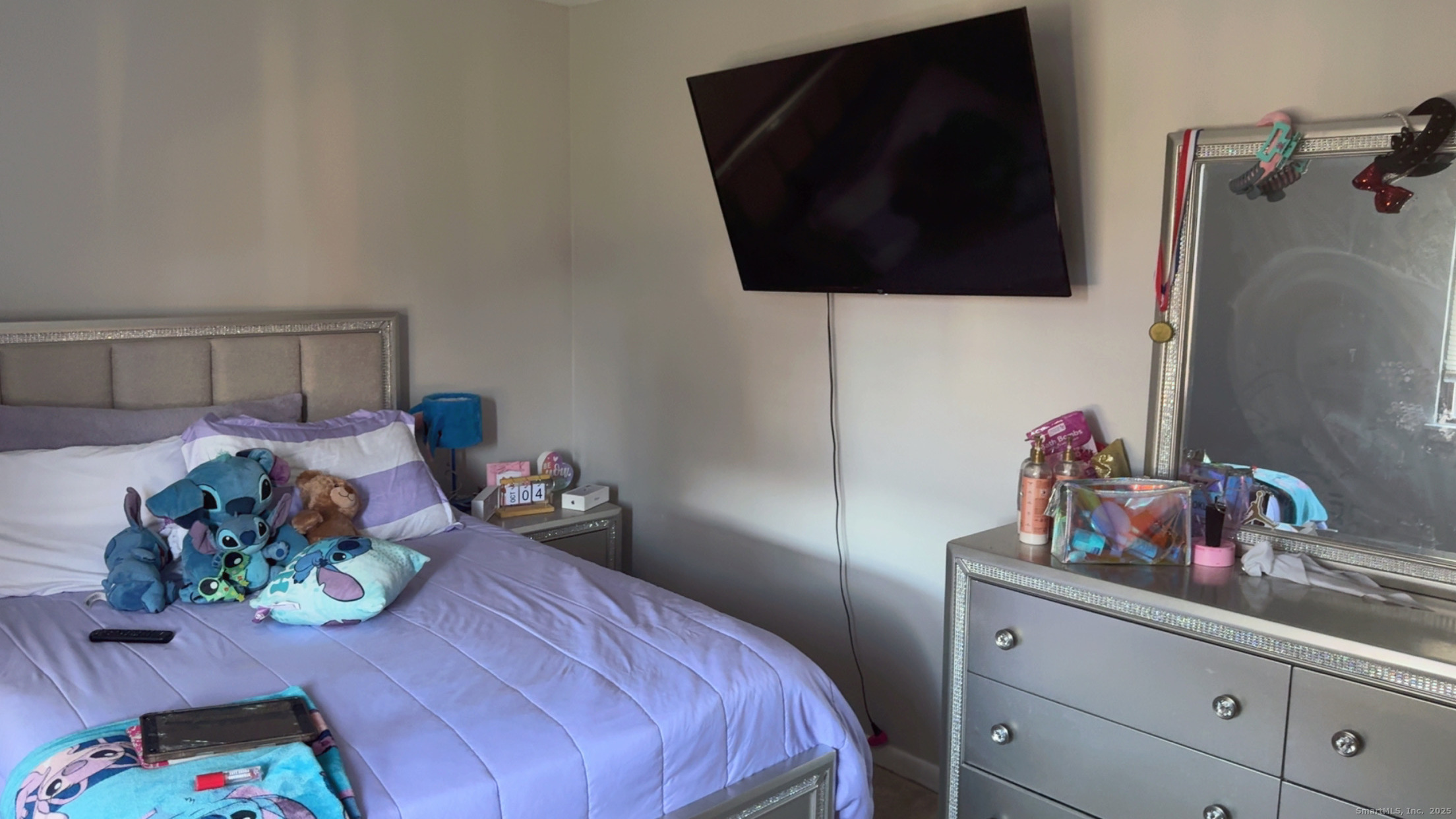 268 High Path Road, Unit 268 Windsor, CT 06095 - Photo 10 of 16 a bedroom with a bed and a flat tv screen on dresser