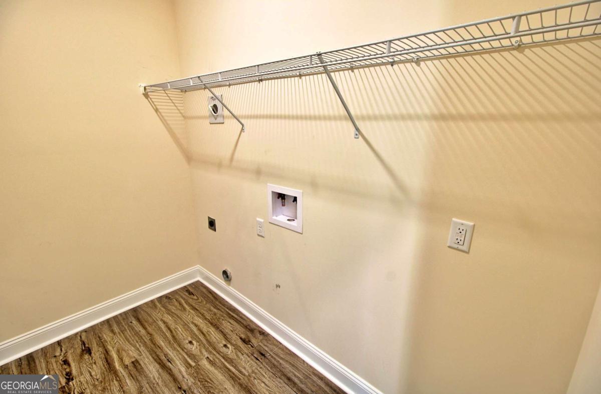 455 Bluff Road Jesup, GA 31545 - Photo 11 of 22 a view of a room with racks on the wall