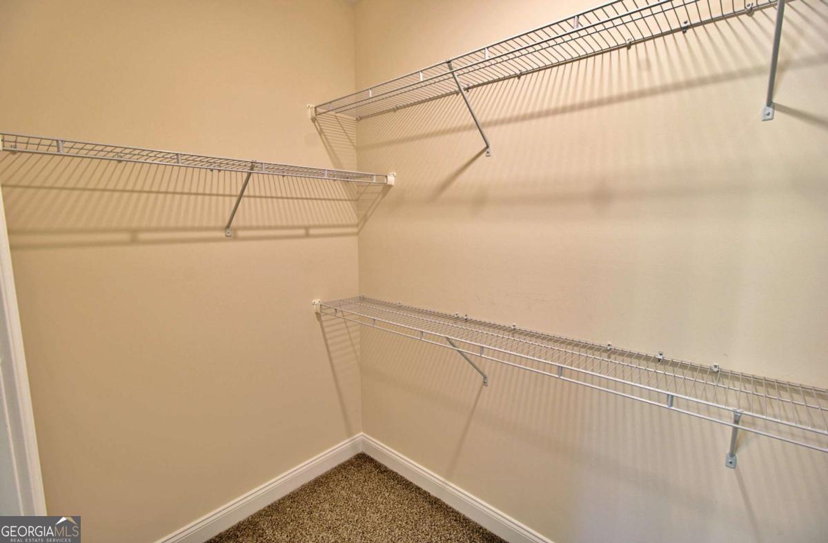 455 Bluff Road Jesup, GA 31545 - Photo 14 of 22 a view of a room with racks on the wall