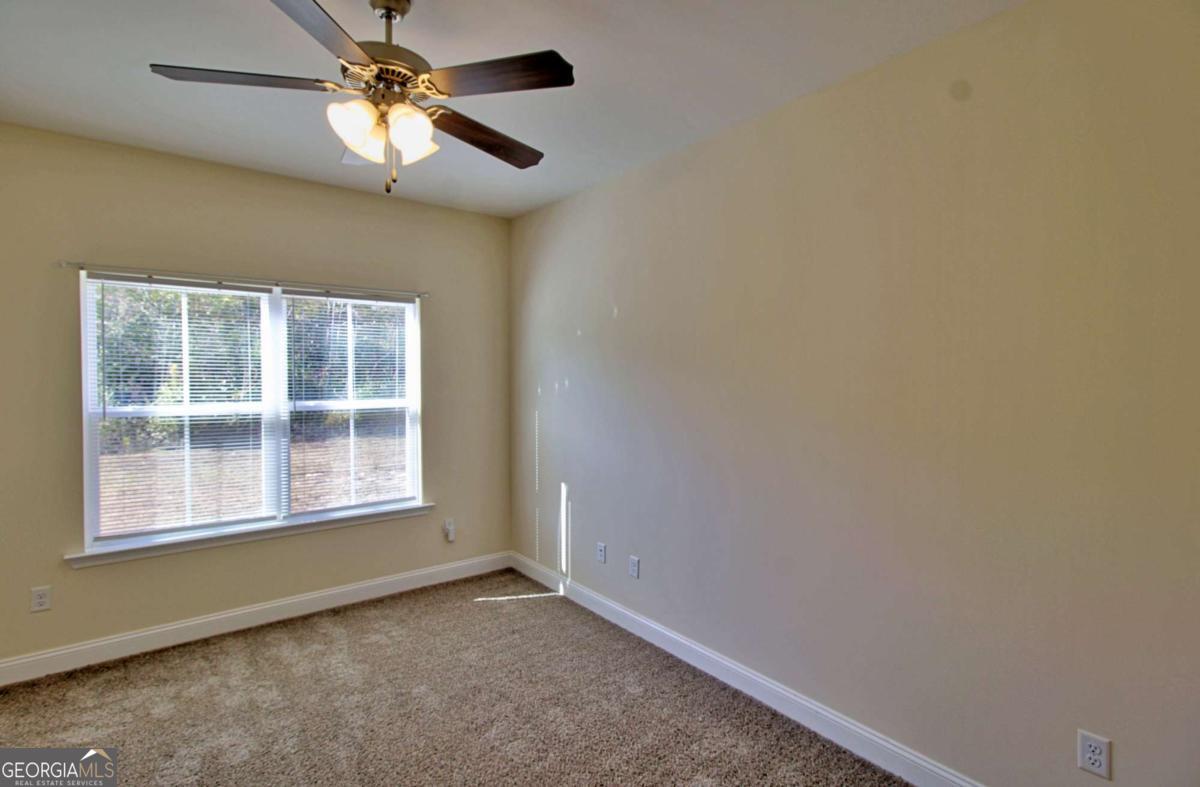 455 Bluff Road Jesup, GA 31545 - Photo 8 of 22 a view of empty room with window