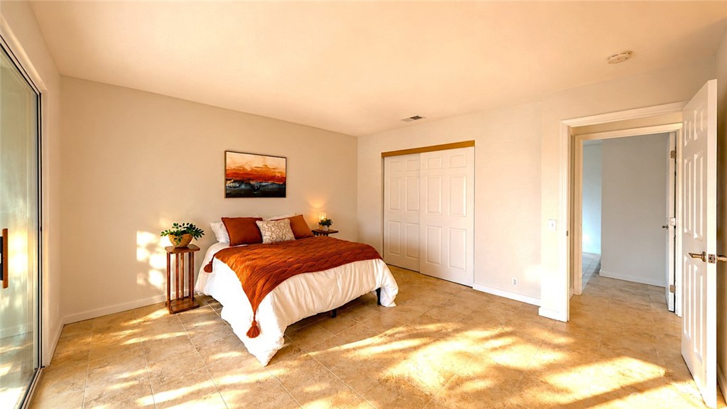 1150 3rd Street Gilroy, CA 95020 - Photo 18 of 28 a bedroom with a bed and a cabinets