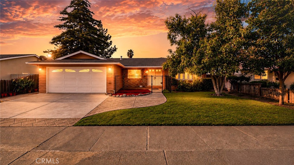 1150 3rd Street Gilroy, CA 95020 - Photo 2 of 28 a front view of a house with a yard and trees