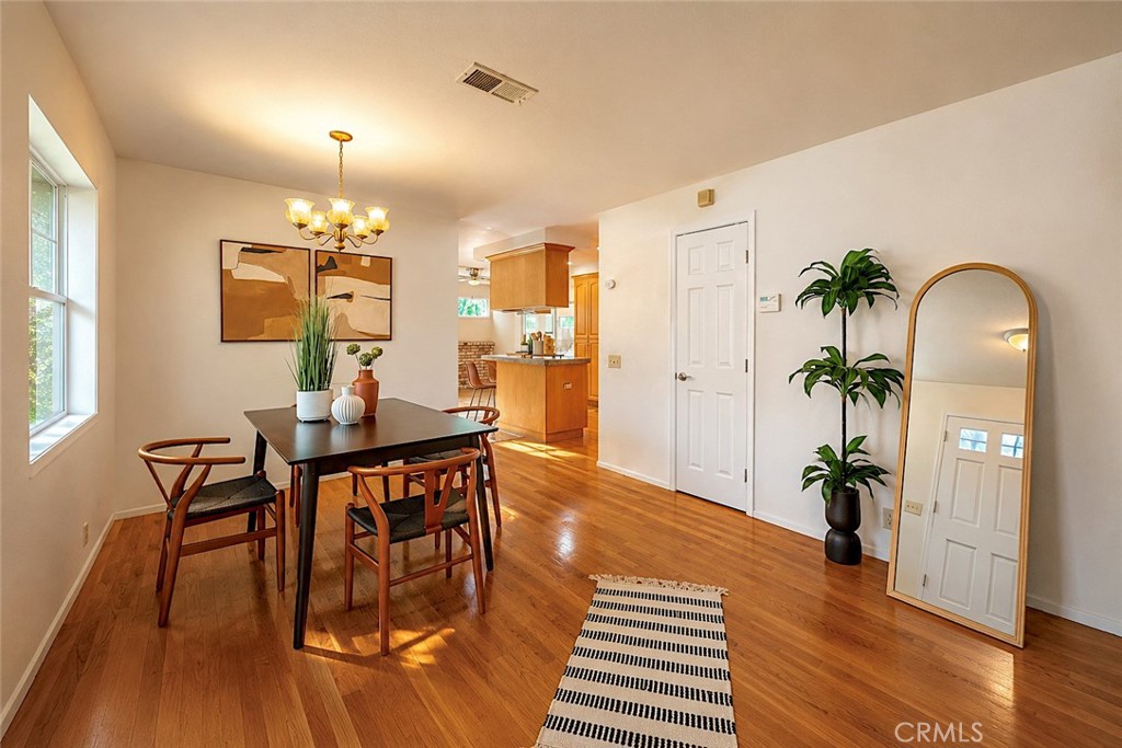 1150 3rd Street Gilroy, CA 95020 - Photo 6 of 28 a view of a dining room with furniture and wooden floor