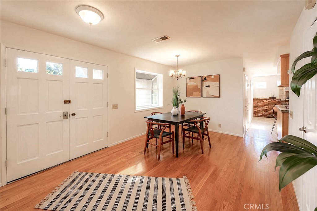 1150 3rd Street Gilroy, CA 95020 - Photo 10 of 28 a view of a dining room with furniture and wooden floor