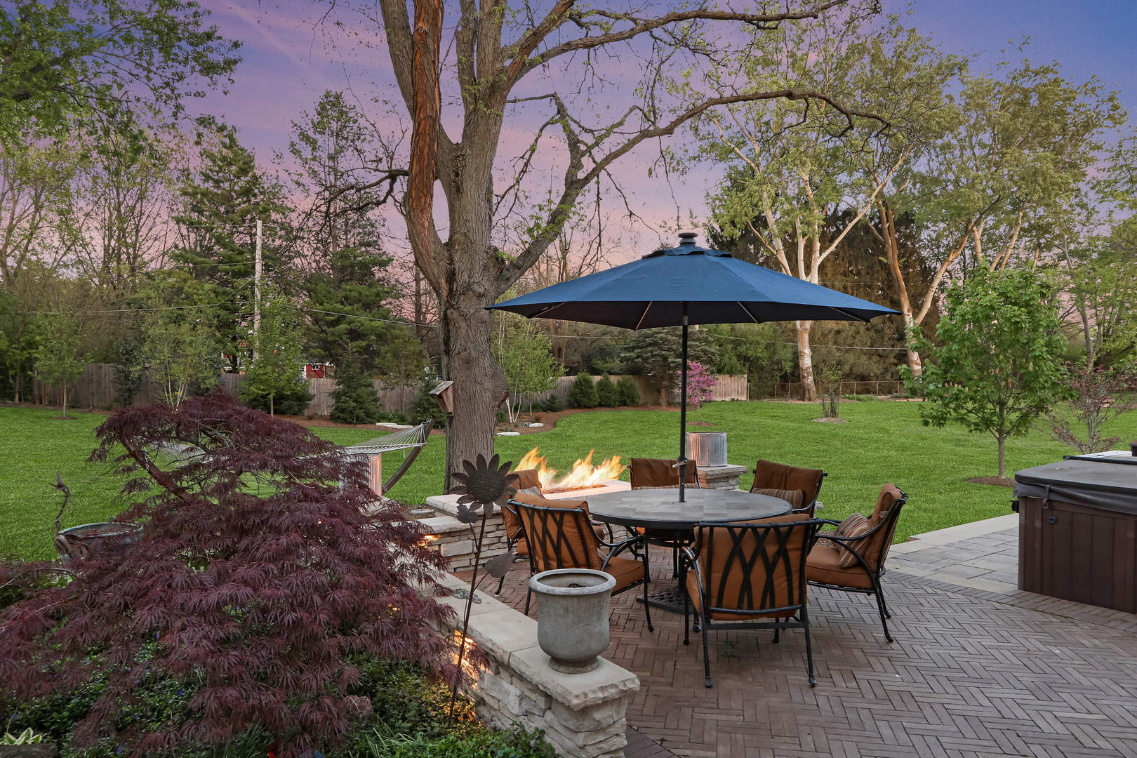 2238 Hanlon Road Libertyville, IL 60048 - Photo 28 of 72 a view of a table and chairs under an umbrella in backyard