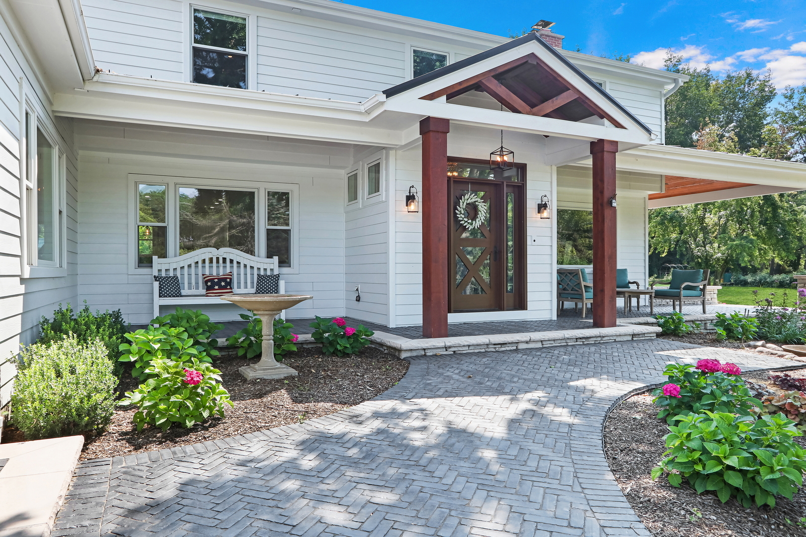 2238 Hanlon Road Libertyville, IL 60048 - Photo 32 of 72 a front view of a house with a yard and potted plants