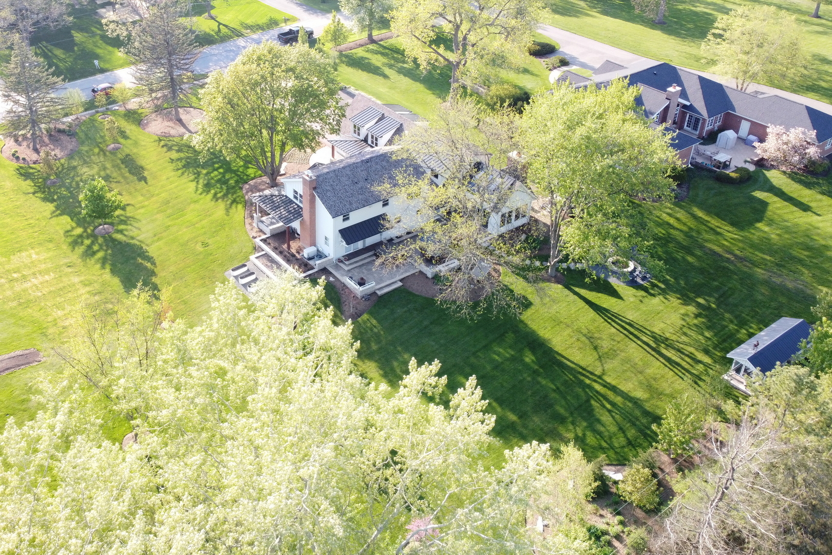 2238 Hanlon Road Libertyville, IL 60048 - Photo 40 of 72 a backyard of a house with a yard and outdoor seating