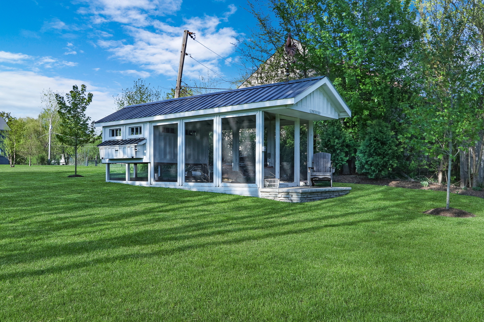 2238 Hanlon Road Libertyville, IL 60048 - Photo 49 of 72 a front view of a house with a yard table and chairs