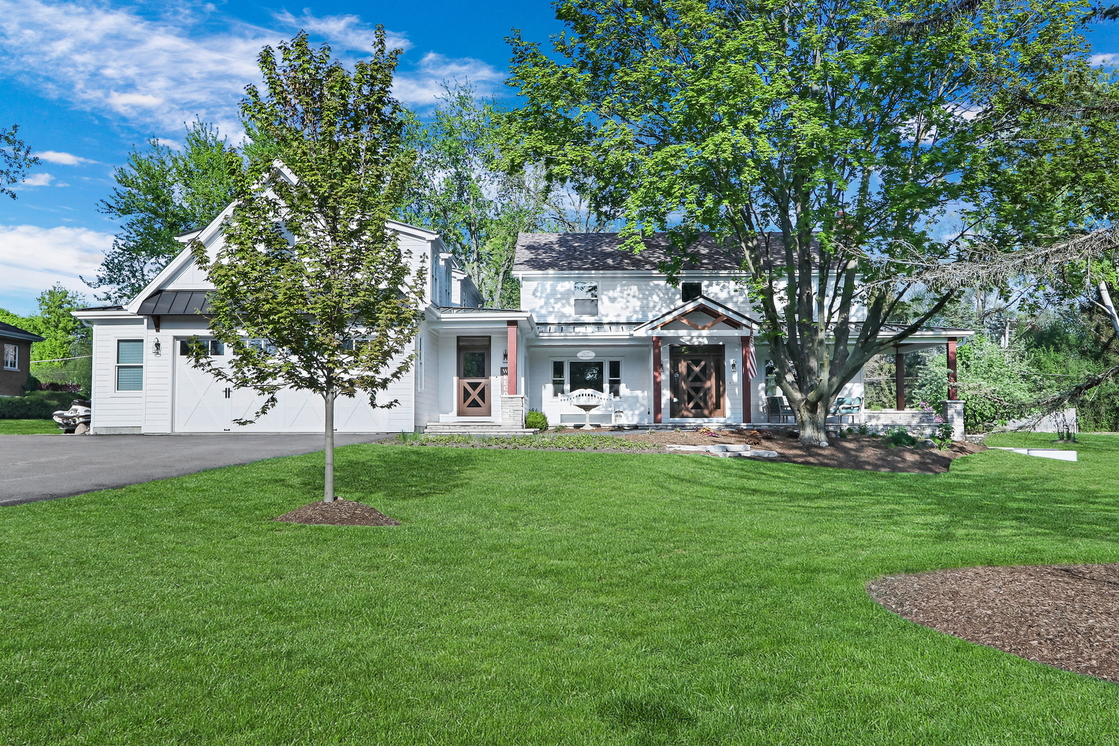 2238 Hanlon Road Libertyville, IL 60048 - Photo 56 of 72 a front view of a house with a garden