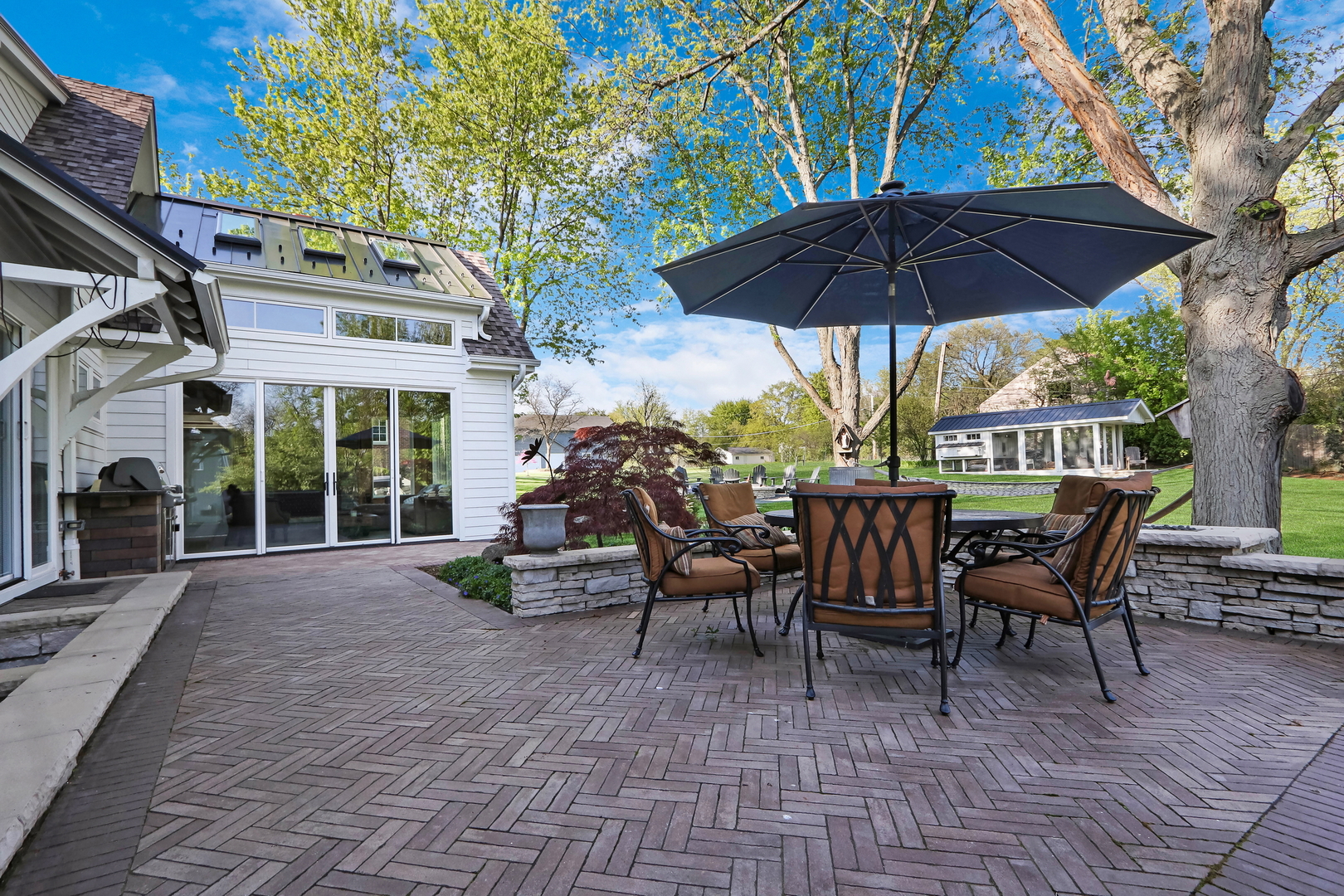 2238 Hanlon Road Libertyville, IL 60048 - Photo 6 of 72 a view of a patio with a table and chairs under an umbrella