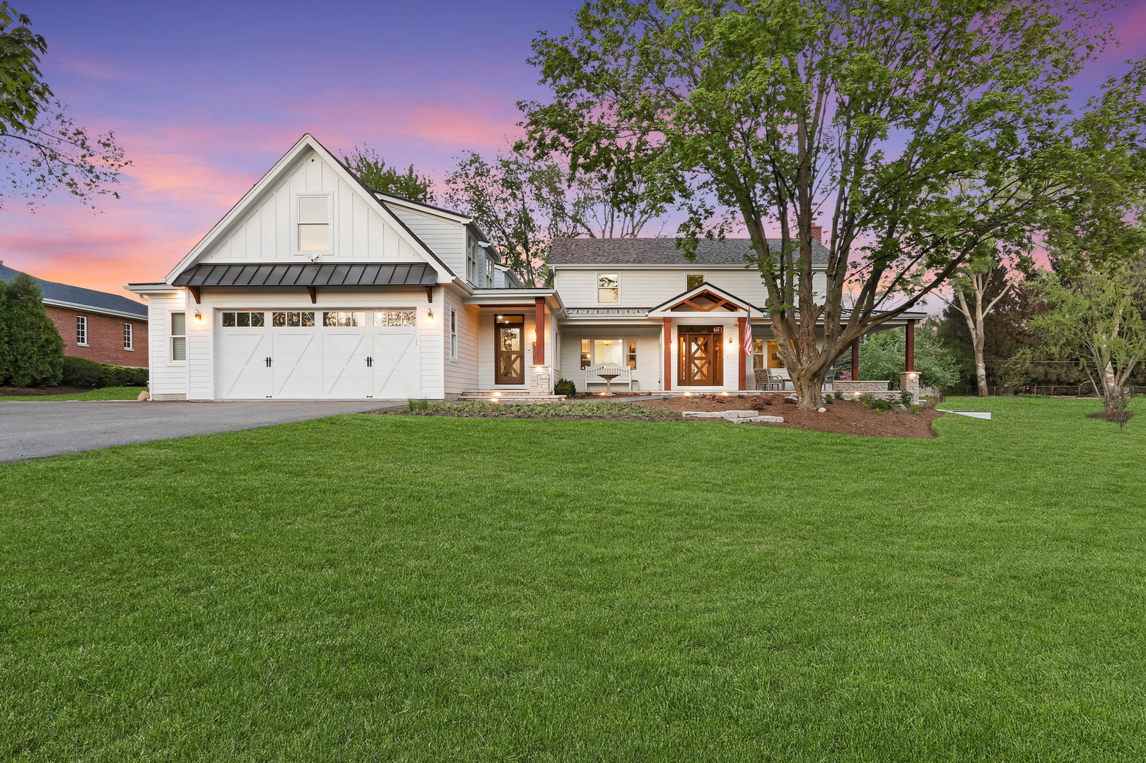 2238 Hanlon Road Libertyville, IL 60048 - Photo 67 of 72 a front view of a house with a garden and trees