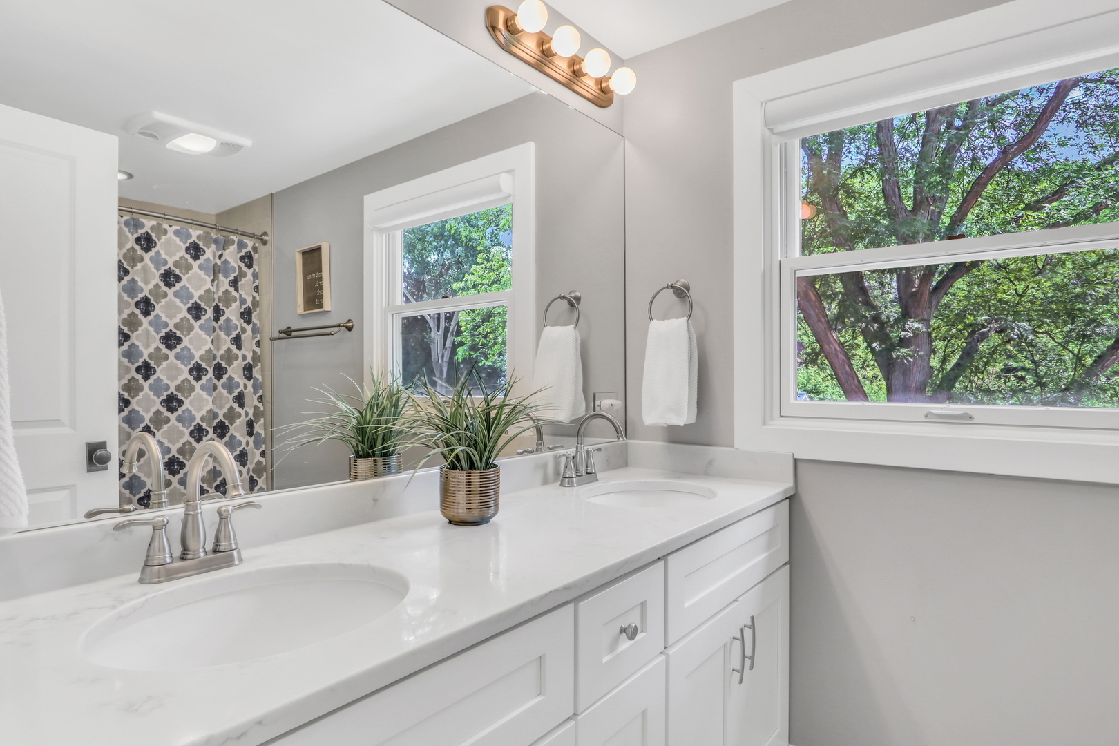 2238 Hanlon Road Libertyville, IL 60048 - Photo 68 of 72 a bathroom with a sink a large mirror and a window